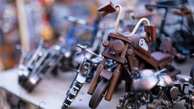 Trinket motorcycles of different sizes, souvenir home decoration product, blurred background, with space and text space