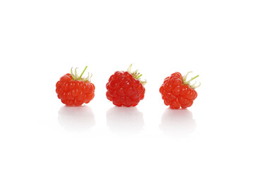 fresh ripe raspberries isolated on a white background
