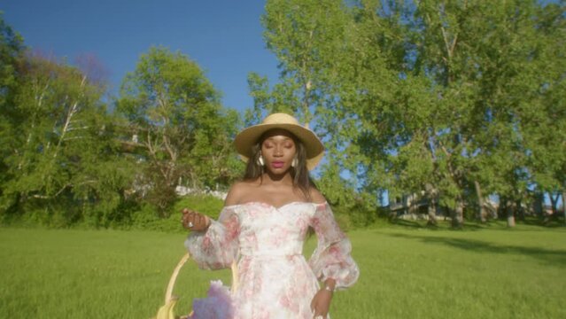 Black Woman looking eye contact in the park close up dolly in