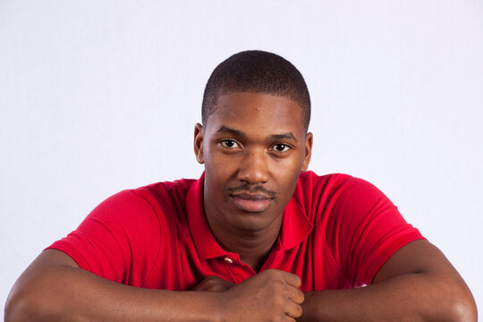 Thoughtful Black Man In A Red Shirt