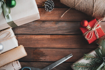 Top view Christmas decorations and ornaments on wooden background with copy space.