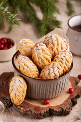 Christmas tree cones cookies with sugar powder. Delicious New Year homemade dessert.