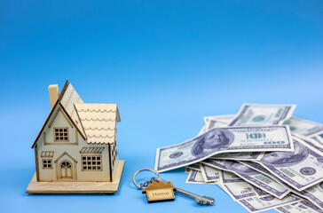 House model with dollar bills and key