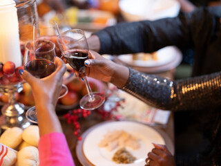 Family raising toast with red wine