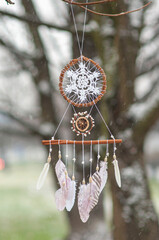 Close up white dream catcher bohemian craft rainy day outdoors