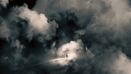A mystical concept of a man on a road floating in the sky. Looking at the bright light of heaven...