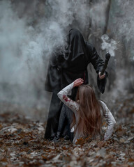 A cultist in a black hoodie attacks a girl