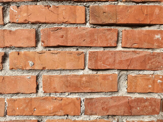 Fototapeta premium The wall made of an old brown bricks