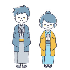 参拝をする着物を着た女性と男性