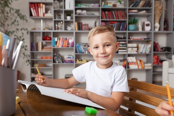 School child learning in classroom.