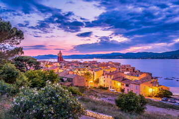 Night fall over Saint Tropez in south of France, scenic view with dramatic sky - obrazy, fototapety, plakaty
