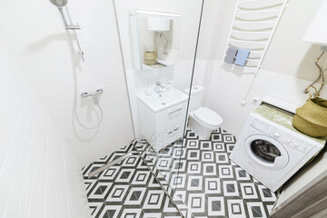 interior design of a stylish bathroom with light tiles