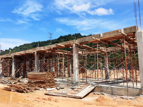 MELAKA, MALAYSIA - MARCH 4, 2021: The building structure is made of reinforced concrete still under construction. This reinforced concrete mold is made of timber and plywood formwork.