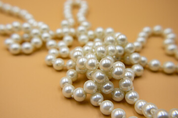 Close-up pearl necklace on isolated background.