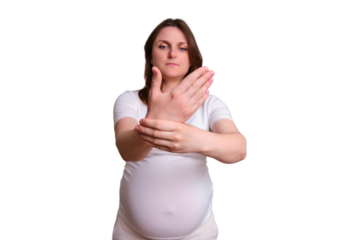 A pregnant woman is holding on to the palm. Tunnel syndrome in the wrist during pregnancy.