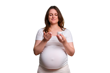 Portrait of a pregnant woman with cream on her hands, white background