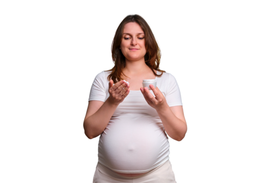 Portrait of a pregnant woman with cream on her hands, white background - Powered by Adobe