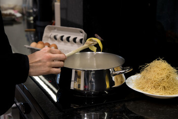 Vermicelli preparation. "Aletria", typical dish of Portuguese gastronomy made with thin dough, milk, lemon peel, cinnamon powder and sticks, sugar and egg yolks. Much appreciated at Christmas time.