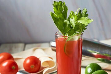 Bloody Mary cocktail in glass on white background on a wooden table.Copyspace