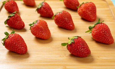 angle view fresh strawberries on wood background