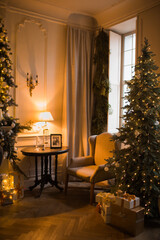 warm and cozy evening in Christmas room interior design,Xmas tree decorated by lights presents gifts,toys, deer,candles, lanterns, garland lighting indoors fireplace.holiday living room.magic New year