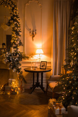 warm and cozy evening in Christmas room interior design,Xmas tree decorated by lights presents gifts,toys, deer,candles, lanterns, garland lighting indoors fireplace.holiday living room.magic New year