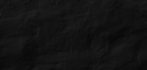 black and dark concrete wall painted with traces of brushes and reliefs. Artistic background texture for photography shot, product display, print creative or website banner.