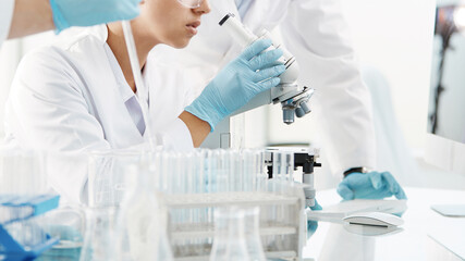 scientists are conducting research in a medical laboratory .