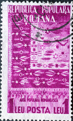 ROMANIA - CIRCA 1953: a postage stamp from Romania, showing the Carpet from Oltenia. Circa 1953