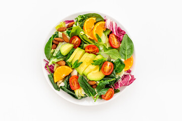 Healthy vegetarian bowl of green salad with avocado and tomatoes