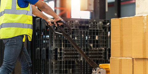 Working at warehouse. Male warehouse worker checking in storage department. Employee organizing goods distribution to the market.