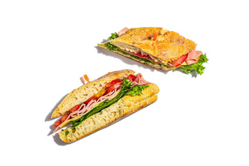Panini sandwich with ham, crispy salad and vegetables isolated on white background