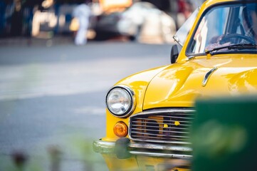 Local Yellow taxi on the street in Kolkata India
