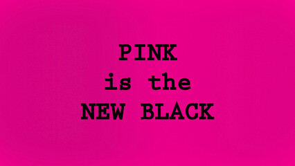 Pink is the new black written on pink background 