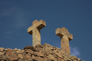 old stone cross on a hill