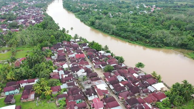 seen from above the beautiful view of the vast expanse of green rice fields, to be precise in Bungo Regency "Dusun Panjang" which includes the houses of residents adjacent to the river "Batang Bungo"