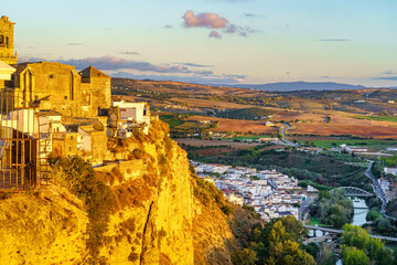 Obraz premium Panoramic of Arcos de la Frontera, white town built on a rock along Guadalete river, in the province of Cadiz, Spain