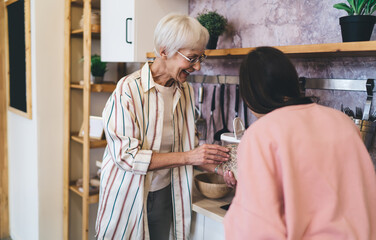 Senior women cooking in kitchen together