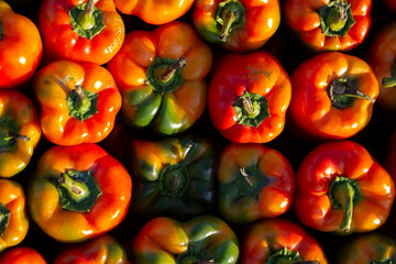 Photo of background with red bell pepper. Concept of buying farm products in the street market of the Georgian city in Tbilisi. Vegetable shop. Fruit store. Top view. Products for cooking vegan food