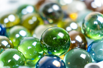 Lots of green glass beads, close-up balls.