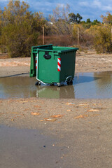 garbage bin in flood water