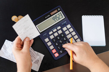 Female hand Calculate coin with notepad. Financial concept, Concept of accounting