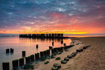 Naklejka na ściany i meble Sunrise over the beach at Baltic Sea in Babie Doly, Gdynia. Poland