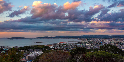 sunset over city by the sea