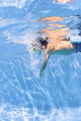 boy swimming in pool