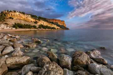 Fototapeta na wymiar Scenic view of rocky Cap Canaille from the old fishing port of Cassis in south of France during golden spring sunset