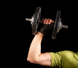Fototapeta na wymiar Strong arm hand lifting dumbbell close up. Pumping, sport concept