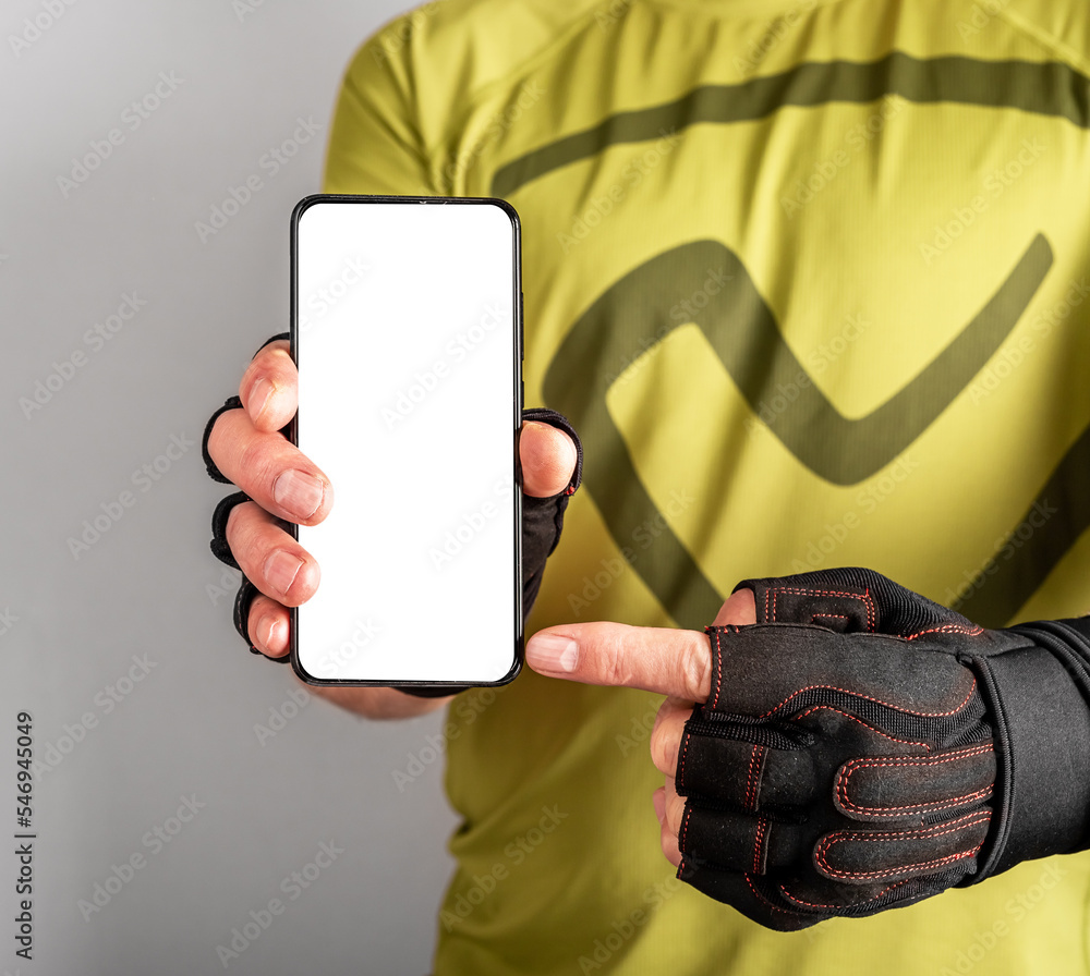 Poster sport application mock up. athlete hand with mobile phone app on white blank screen of smartphone mo
