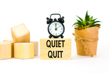Quiet quit symbol. Concept words Quiet quit on wooden blocks. Beautiful white table white...