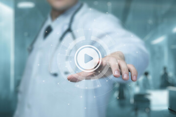 Doctor presses on button to start video .